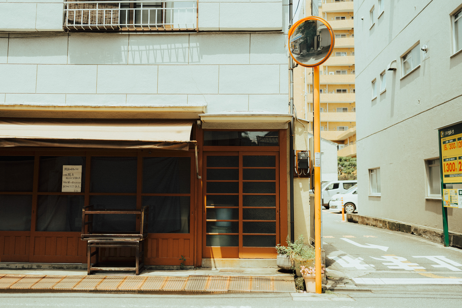 Empty shopfront with wooden facades at the corner of an empty street